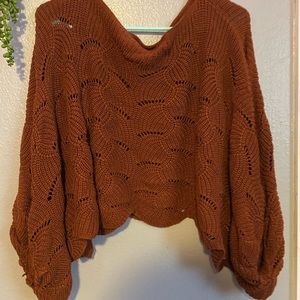 A brown sweater/poncho